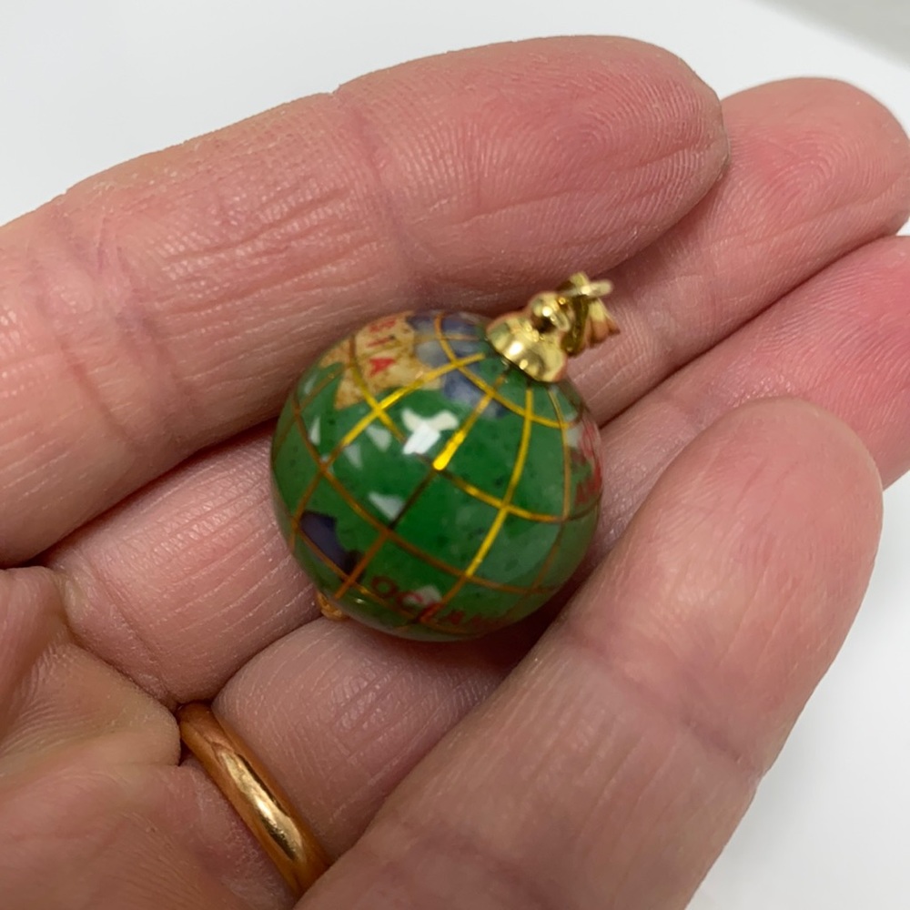The world 14k gold charm